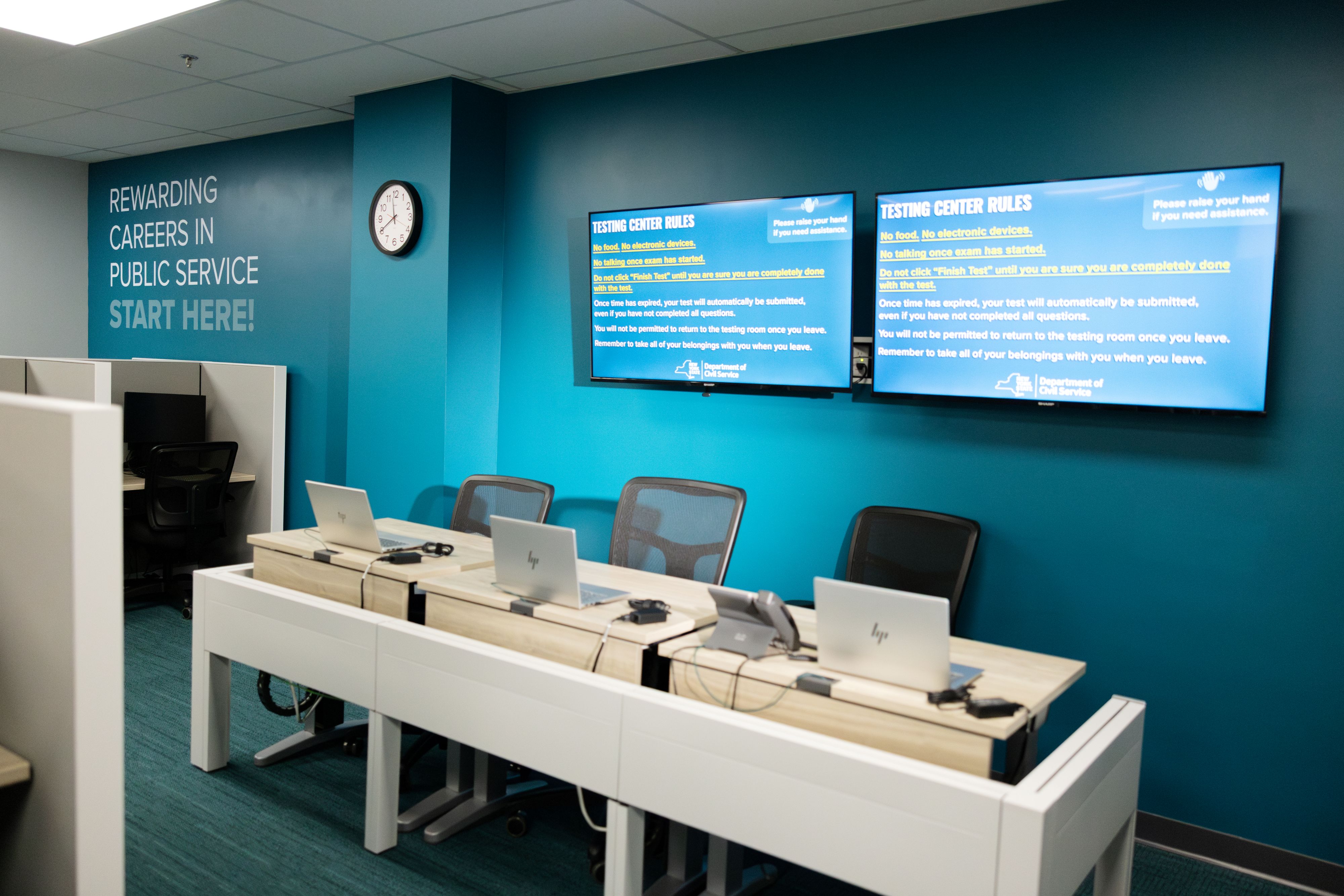 a view inside a CBT-3 testing desks with laptops.